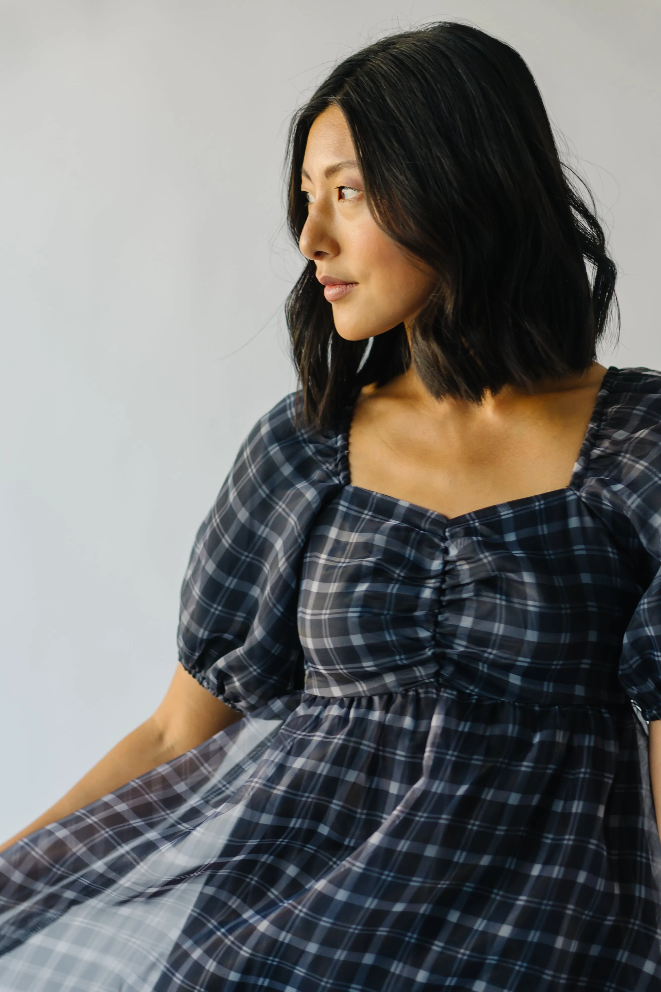 The Osburn Babydoll Dress in Black Plaid