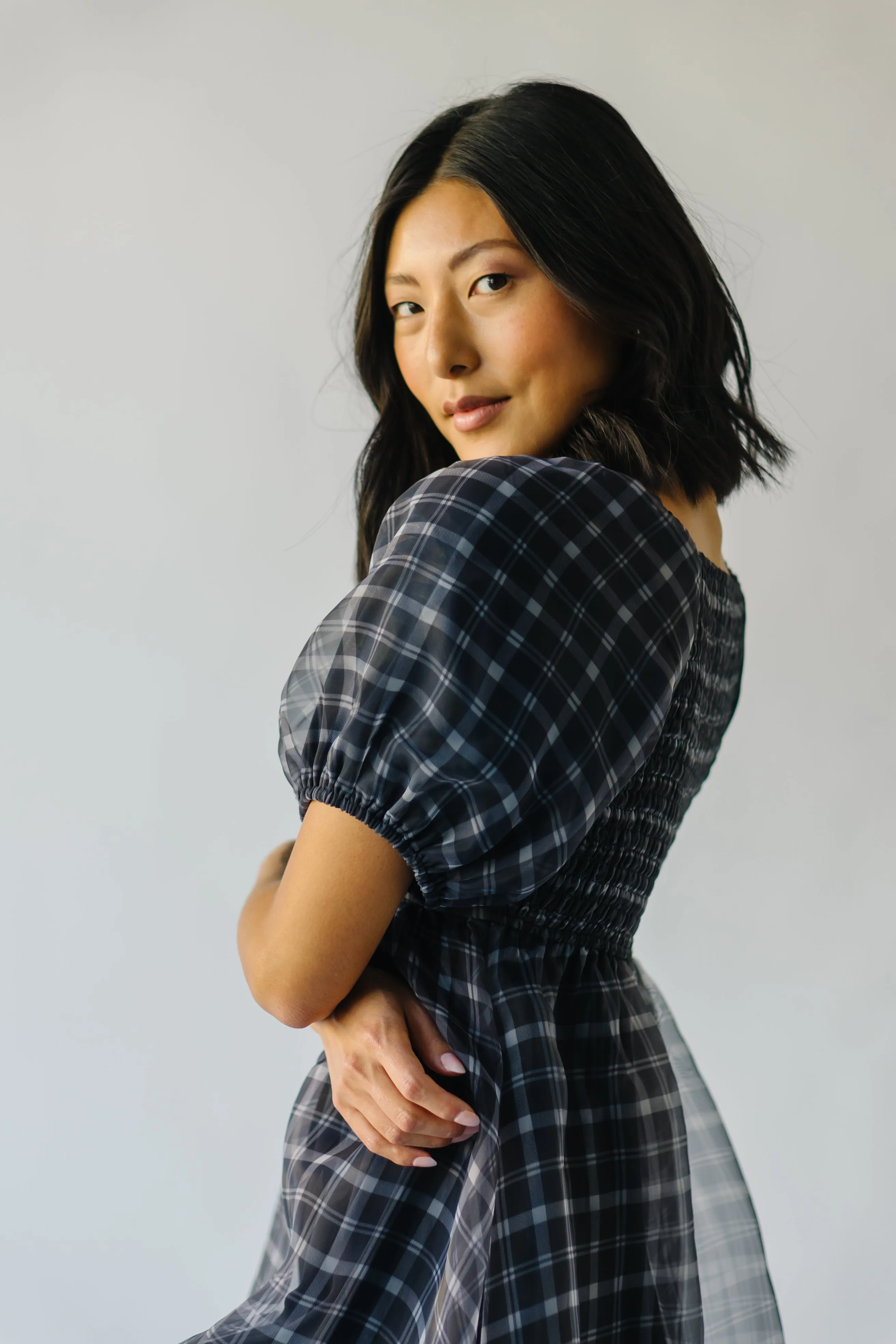 The Osburn Babydoll Dress in Black Plaid